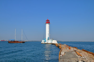 Walking brig sailing near the Odessa lighthouse.