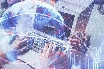 Double exposure of hands and notepad with business icons. Concept of international business.