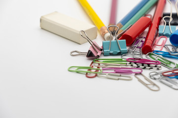 Colorful office tools set, pen, binder, paper clip, pencils, eraser isolated on white background
