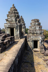 Ruins of old Phnom Bakheng Temple in Angkor in Cambodia. The temple was constructed in the late 9th and early 10th century during the reign of the King Yasovarman I.