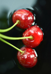 cherry on a black background, healthy food