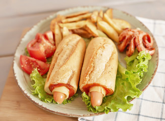 hot dog with vegetables and beer on the oktoberfest table
