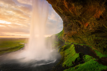 Beautiful waterfall Seljalandsfoss at the sunset in Iceland.