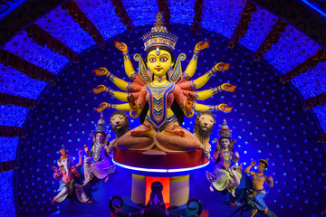 Idol of Goddess Devi Durga at a decorated puja pandal in Kolkata, West Bengal, India. Durga Puja is...