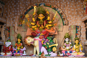 Idol of Goddess Devi Durga at a decorated puja pandal in Kolkata, West Bengal, India. Durga Puja is...