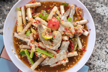 Papaya salad or what we called in Thai Som Tum with lotus stem is the popular Thai style local the eastern delicious famous food of Thailand