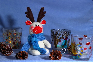 Textile toy of elk (deer, reindeer). Concept of joy and winter holidays