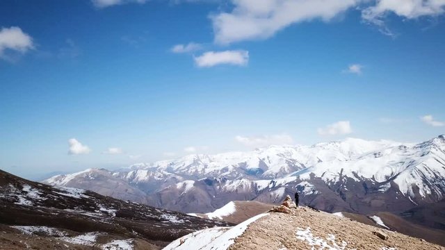 Drone Footage Of Woman Taking Photos Of A Scenic Mountain Range