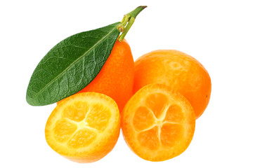 Cumquat or kumquat with slices and leaves isolated on white background