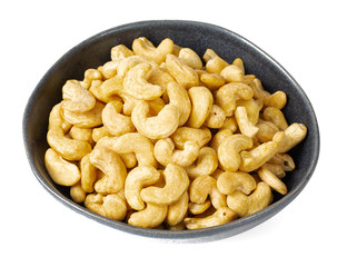 cashew nuts in a bowl isolated on white background