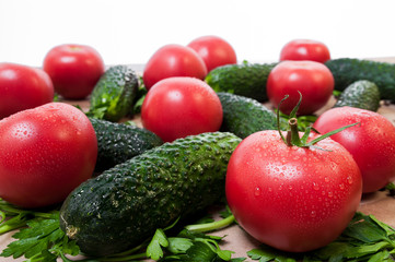 Organic vegetables tomatoes cucumbers parsley over craft paper. Zero waste, plastic free concept. Healthy clean eating diet and detox. Top view, flat lay. Veggie ingredients for cooking.