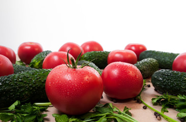 Organic vegetables tomatoes cucumbers parsley over craft paper. Zero waste, plastic free concept. Healthy clean eating diet and detox. Top view, flat lay. Veggie ingredients for cooking.