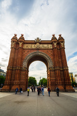 Barcelona, Spain – 2019. People are strolling through an alley between the arch of triumph and Ciutadella park Barcelona, Spain.