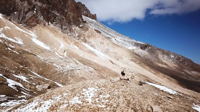 Solo Woman Taking Photos And Admiring The Views On Top Of A Tall Mountain