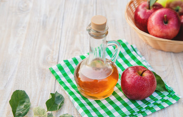 Apple cider vinegar in a bottle. Selective focus.