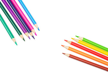 Group of eleven whole colored pencil cold and warm gamma flatlay isolated on white background