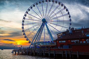 The ferris wheel on the waterfront of Seattle, Washington in late afternoon light