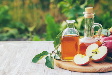 Apple cider vinegar in a bottle. Selective focus.