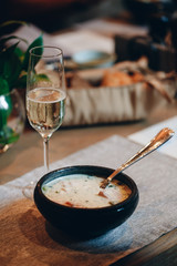 tableware Glasses, flower fork, knife served for dinner in restaurant with cozy interior