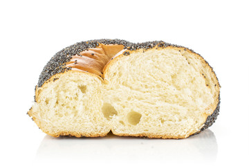 One half of twisted poppy seed bun cross section isolated on white background
