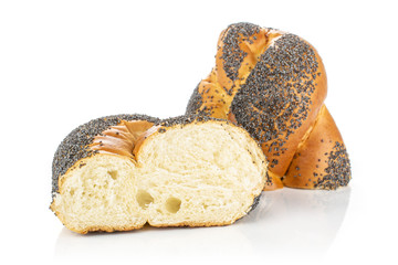 Group of two halves of twisted poppy seed bun isolated on white background
