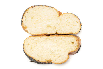 Group of two slices of fresh twisted poppy seed bun flatlay isolated on white background