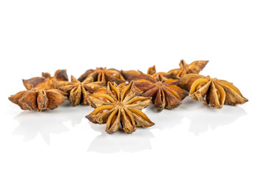 Lot of whole dry brown star anise illicium verum isolated on white background