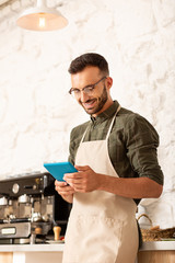 Businessman smiling while enjoying working process