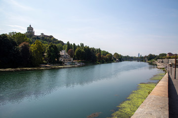 Fototapeta na wymiar The river Po in Turin, Italy with the Vittorio Emanuele bridge in the background