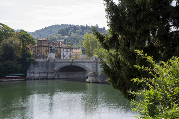Fototapeta premium The Vittorio Emanuele bridge over the river Po in Turin, Italy