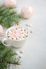 Obraz na płótnie Canvas Cup of hot chocolate with marshmallows on a gray concrete background. Christmas concept.