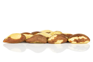 Lot of whole raw brown brazil nut isolated on white background