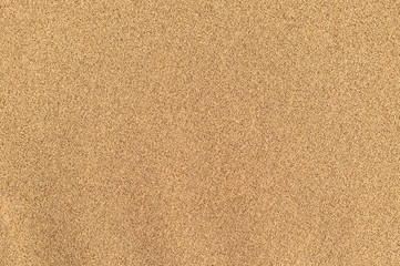 Fototapeta na wymiar Golden texture of the sand 