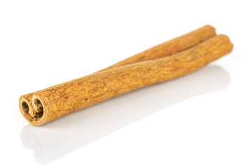 One whole dry brown cinnamon isolated on white background