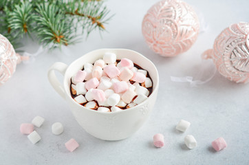 Cup of hot chocolate with marshmallows on a gray concrete background. Christmas concept.
