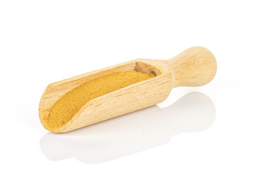 Dry brown cinnamon in a wooden scoop isolated on white background