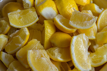 Сhopped lemons slices in home kitchen.