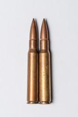 Two rifle bullets on white background.