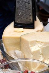 halves of the cheese heads on the counter with grate