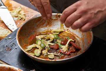 Cooking sauce for pasta in frying pan. close up photo