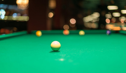 White ball on a pool table.