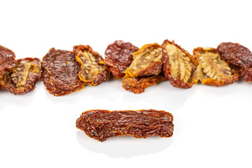 Lot of whole dried red tomato isolated on white background