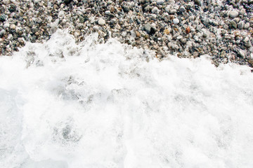 wave with foam on the shore
