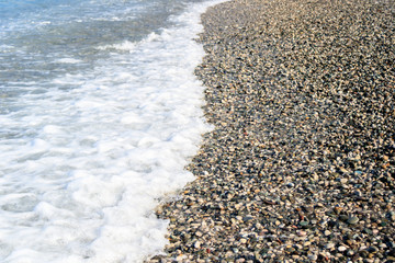 surf on a pebble beach, ocean