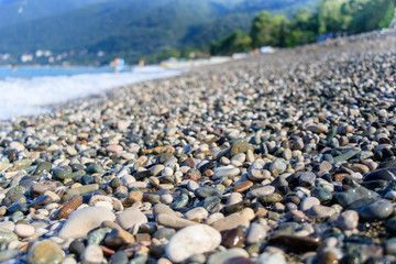 rest on the sea, pebble beach, near the mountains