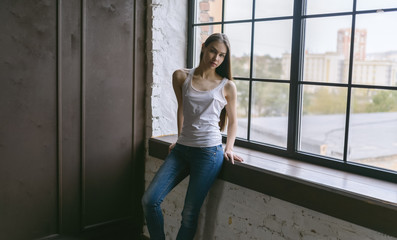 Portrait of a beautiful young brunette. Selective soft focus.