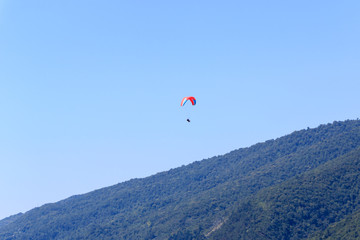 paragliding over the mountains.