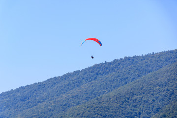 flight with an instructor on a paraglider over the mountains.