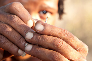 Bushman making fire in Africa