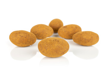 Group of six whole sweet brown chocolate cinnamon almond isolated on white background